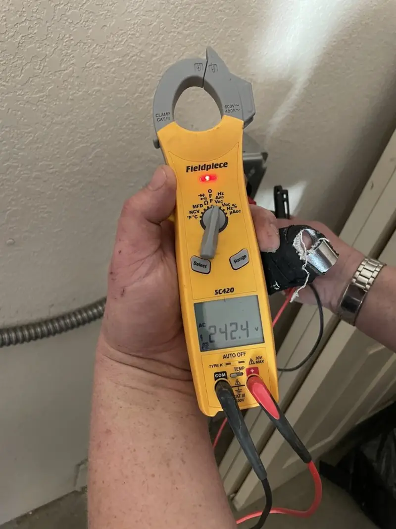 Voltage testing with clamp meter during Outlet Installation in Suffolk